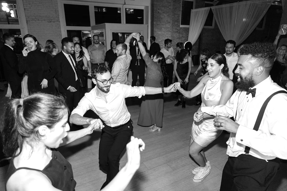 Wedding guests dancing at THE 101 winter wedding reception in Seattle WA