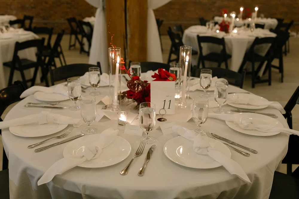 Wedding reception table details with red florals at THE 101 Seattle WA