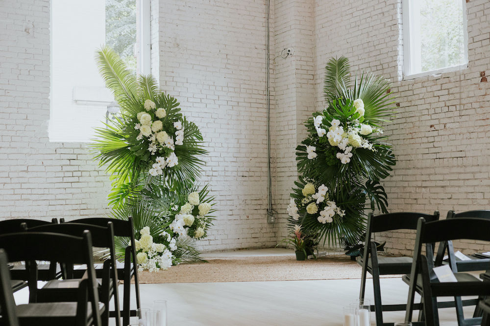 Ceremony arch with tropical floral set up at THE 101 in Seattle, Washington