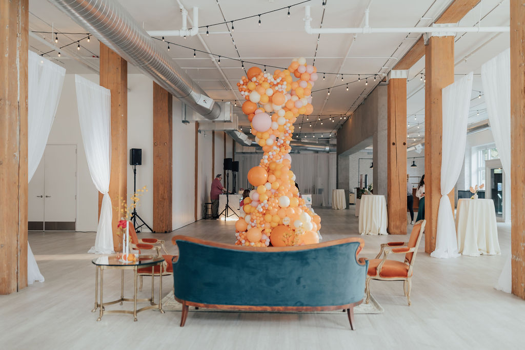 Vintage lounge set with a large balloon installation at THE 101 in Seattle, Washington
