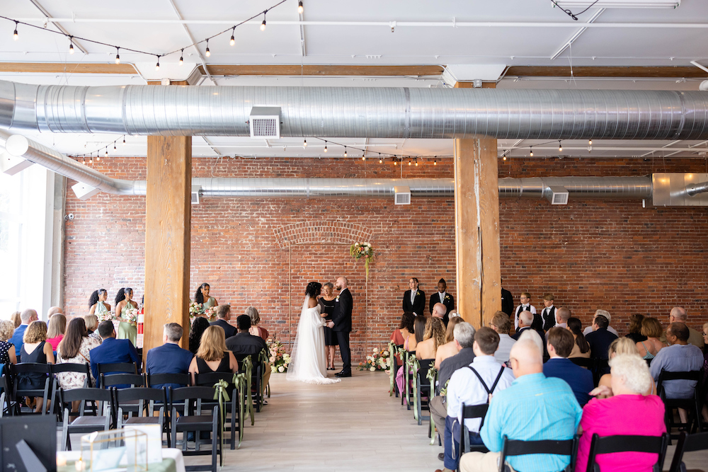 A bride and groom get married at THE 101 in Seattle