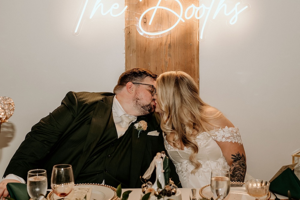 Bride and groom kissing on wedding day at THE 101 