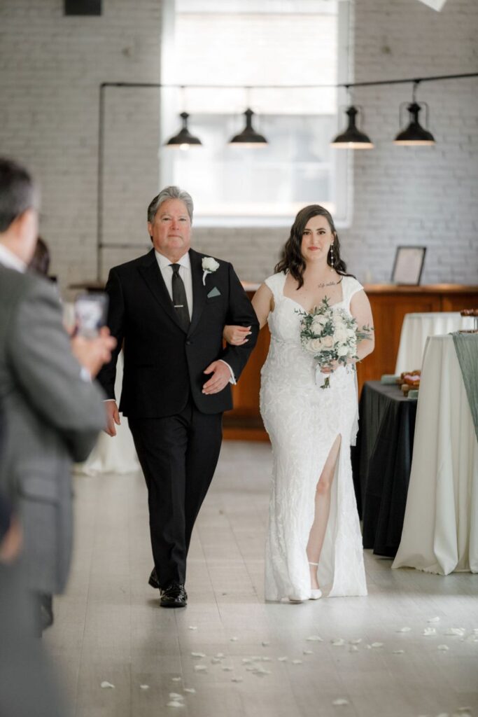 Bride and her dad walking down the aisle on her wedding day