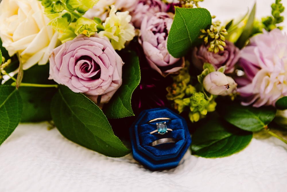 Wedding ring and flowers detail shot