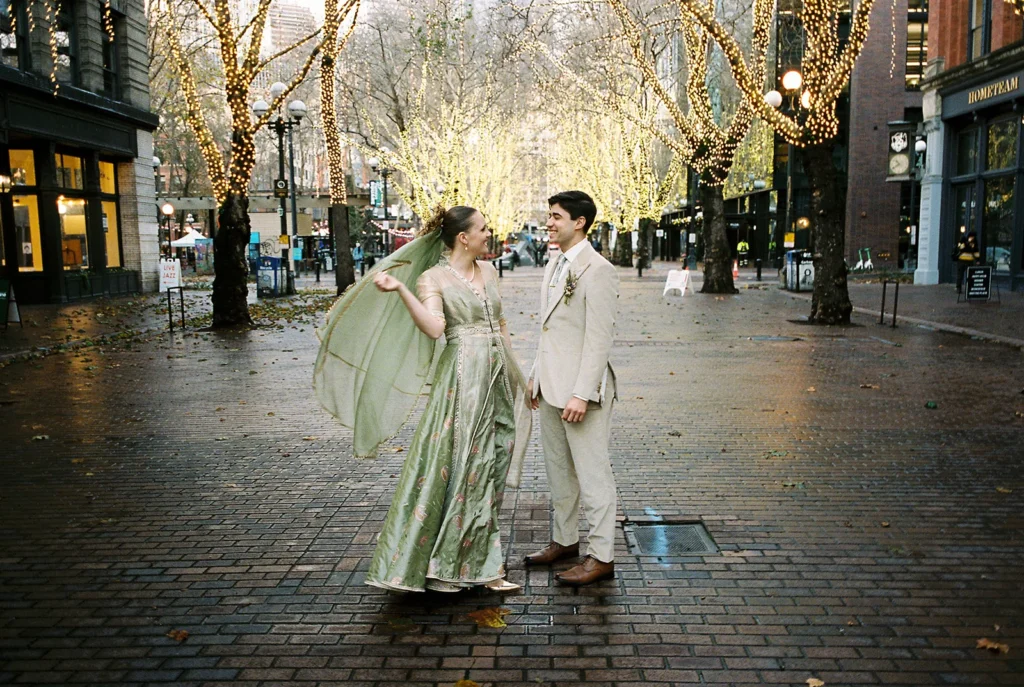 Bride and groom posing in Pioneer Square Seattle