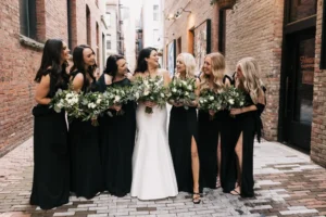Wedding party taking photos outside of THE 101 in Seattle