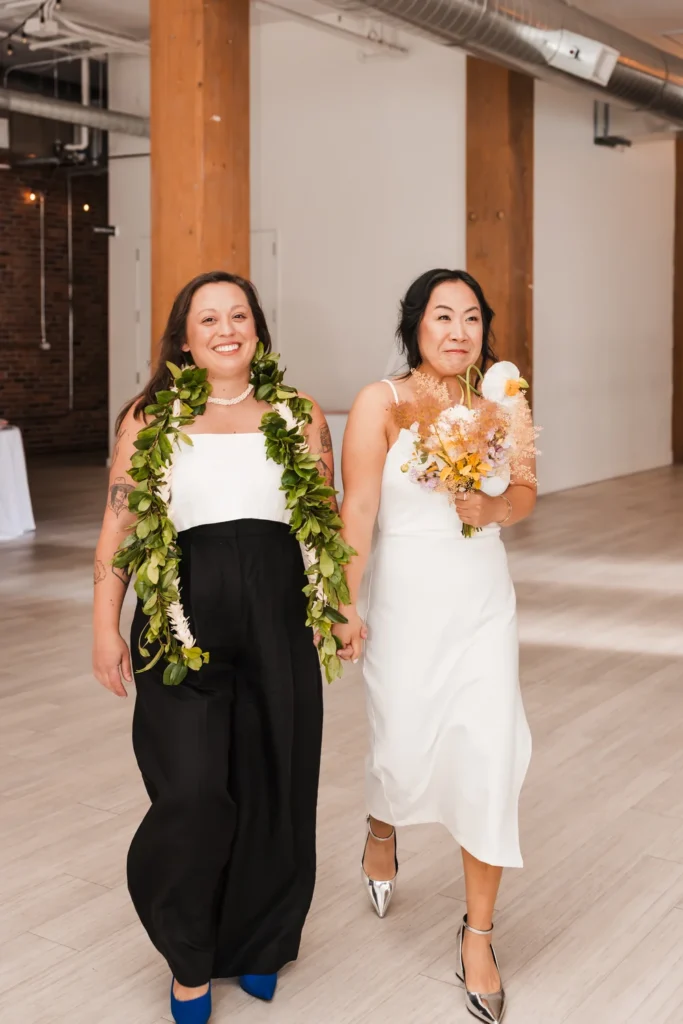 Brides walking down the aisle at THE 101 in Seattle