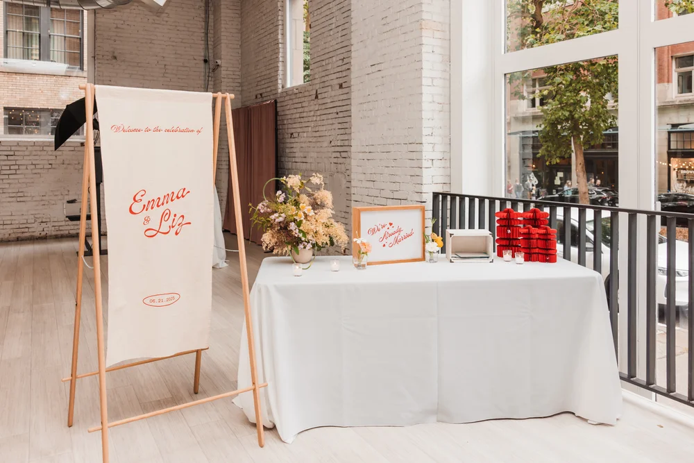 Welcome sign and gift table at a wedding at THE 101 in Seattle