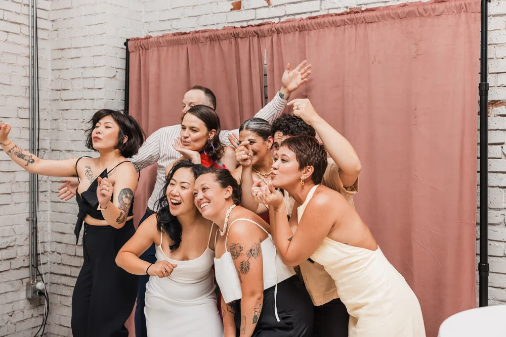 Guests posing for a photo at THE 101 in Seattle