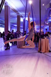 A silk aerialist performing at THE 101 in Seattle, Washington.