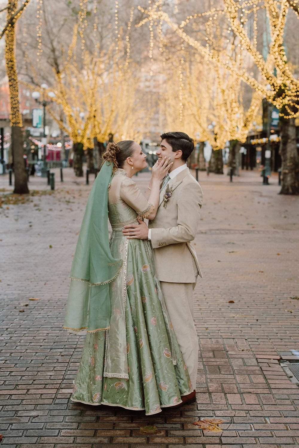 Couple embracing during a winter engagement photo session in Pioneer Square, Seattle