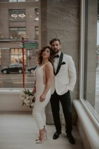 Couple posing for engagement photos at THE 101 in Pioneer Square Seattle