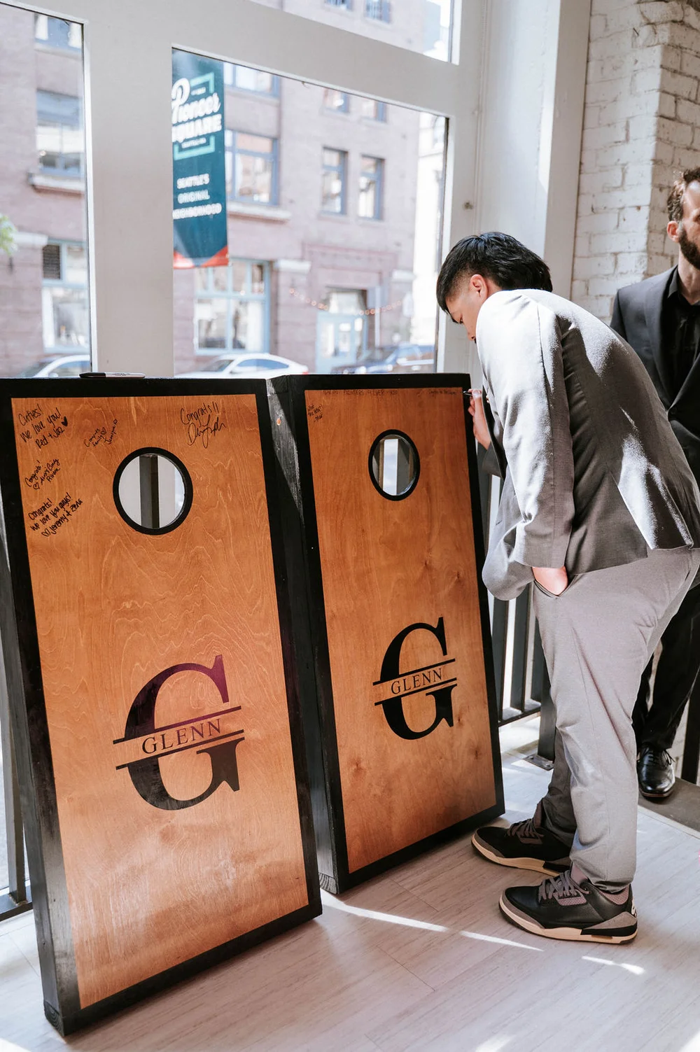 Custom cornhole boards used as a guest book at a wedding at THE 101 Seattle