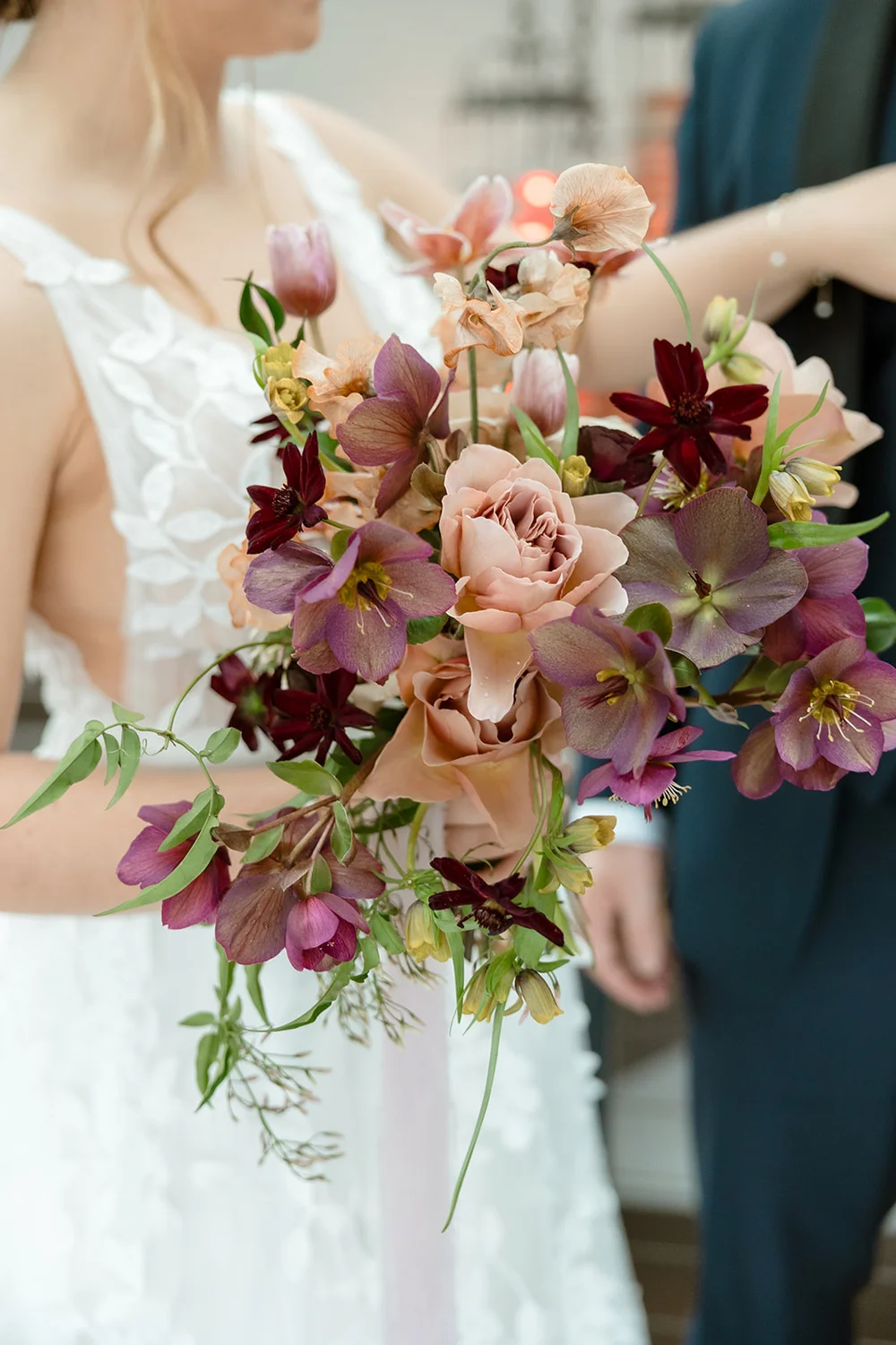 March wedding bouquet in Seattle featuring hellebore and ranunculus