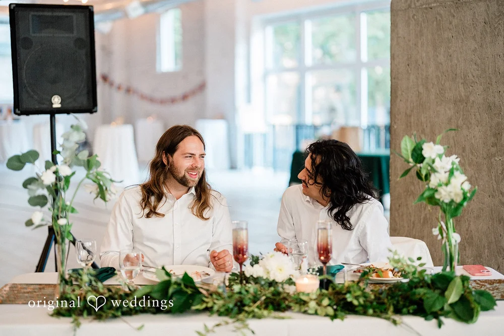 Couple enjoying their dinner on their wedding day at THE 101 in Seattle
