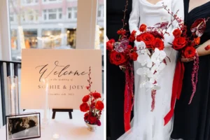 Welcome to a wedding sign and bridesmaids holding red florals